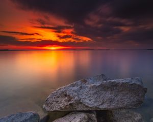 Preview wallpaper ocean, water, stones, horizon, sunset