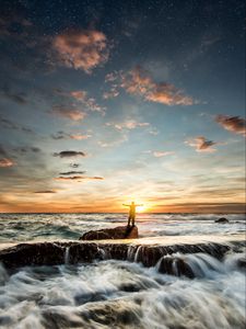 Preview wallpaper ocean, waves, foam, stones, man, silhouette, sunset