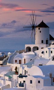 Preview wallpaper oia, greece, city, houses, sunset, ocean, water, sky, clouds