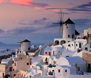 Preview wallpaper oia, greece, city, houses, sunset, ocean, water, sky, clouds