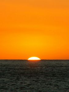 Preview wallpaper orange, dark blue, sea, horizon, sun