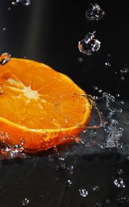 Preview wallpaper orange, segment, splashes, water