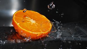 Preview wallpaper orange, segment, splashes, water