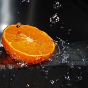 Preview wallpaper orange, segment, splashes, water
