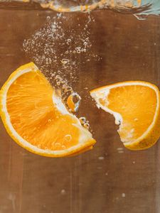 Preview wallpaper orange, slices, bubbles, water