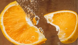 Preview wallpaper orange, slices, bubbles, water