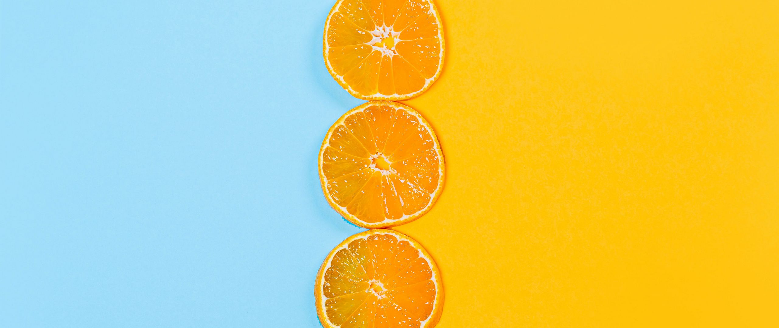 2560x1080 Wallpaper orange, slices, fruit, citrus