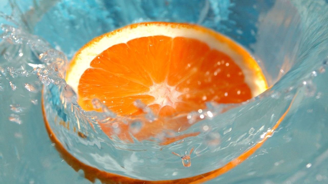 Wallpaper orange, water, splashes