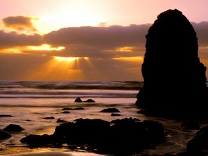 Preview wallpaper oregon, stones, blocks, sea, waves, decline, sun rays, clouds