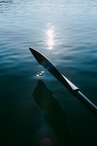 Preview wallpaper paddle, boat, ripples, glare, water