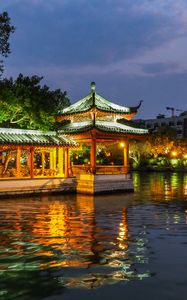 Preview wallpaper pagoda, building, backlight, trees, lake, twilight