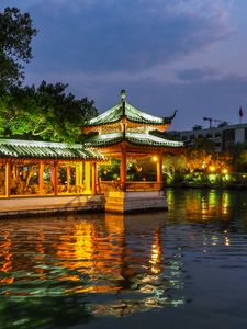 Preview wallpaper pagoda, building, backlight, trees, lake, twilight