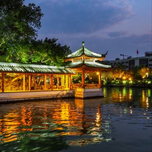 Preview wallpaper pagoda, building, backlight, trees, lake, twilight