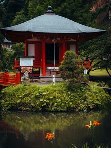 Preview wallpaper pagoda, building, pond, grass, japan, landscape