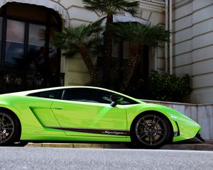 Preview wallpaper palm trees, building, green, lamborghini