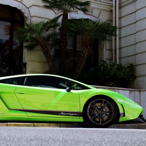 Preview wallpaper palm trees, building, green, lamborghini