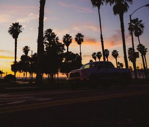 Preview wallpaper palm trees, dark, road, car, dusk