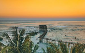 Preview wallpaper palm trees, ocean, sunset, pier, building