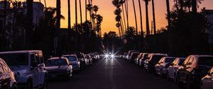 Preview wallpaper palm trees, twilight, street, road, cars