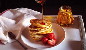 Preview wallpaper pancakes, strawberries, berries, honey, watering, breakfast, dessert