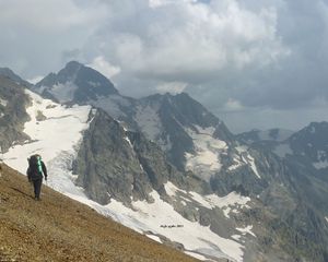 Preview wallpaper panorama, mountains, person, ascension, climber, loneliness