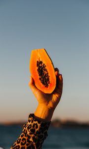 Preview wallpaper papaya, fruit, exotic, hand