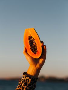 Preview wallpaper papaya, fruit, exotic, hand