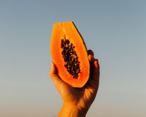 Preview wallpaper papaya, fruit, exotic, hand