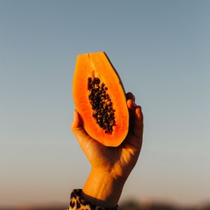 Preview wallpaper papaya, fruit, exotic, hand