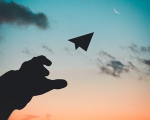 Preview wallpaper paper airplane, hand, sky, sunset