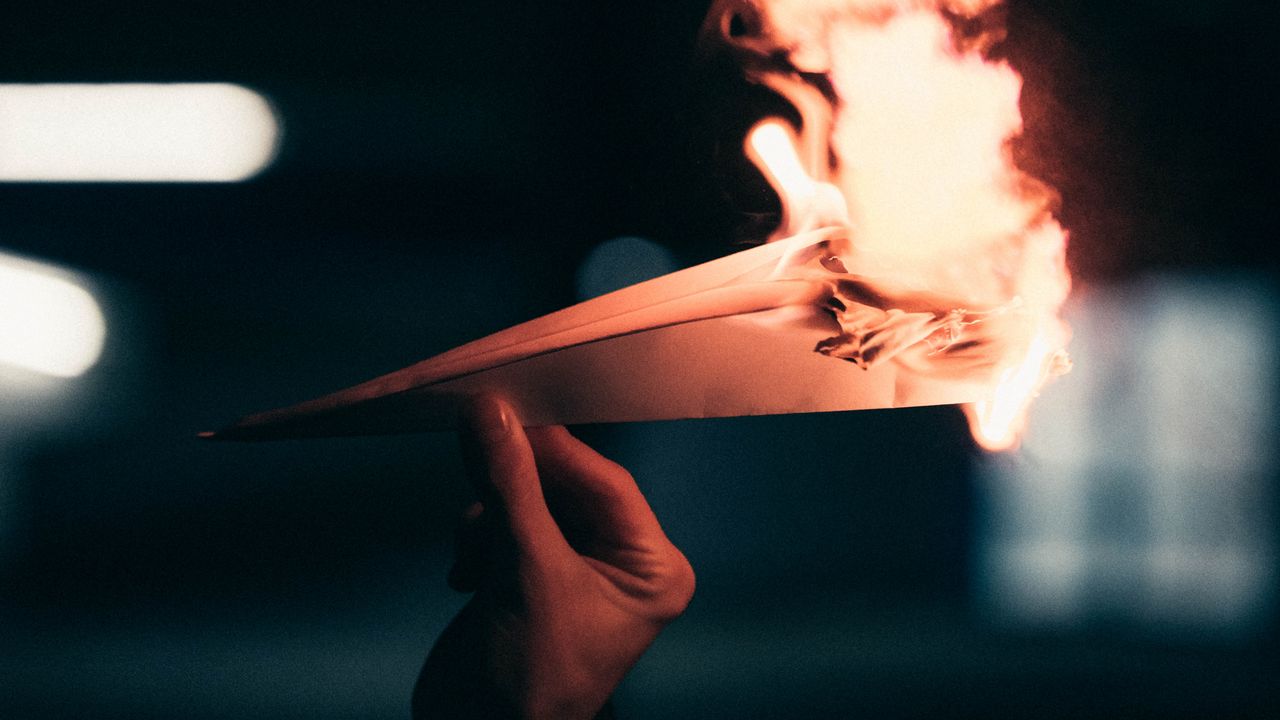 Wallpaper paper plane, fire, hand, dark