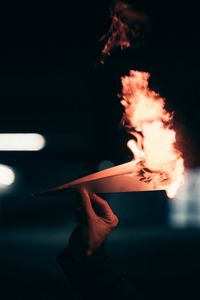 Preview wallpaper paper plane, fire, hand, dark