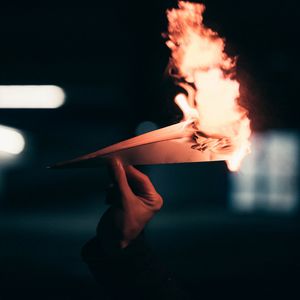 Preview wallpaper paper plane, fire, hand, dark