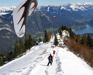 Preview wallpaper parachute, landing, extreme, snow, mountains, road