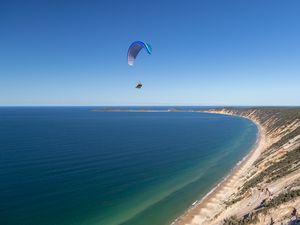 Preview wallpaper parachute, parachutist, jump, sea, extreme
