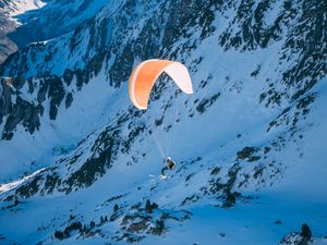 Preview wallpaper parachutist, parachute, mountains, snow, extreme