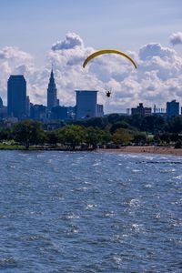 Preview wallpaper parachutist, parachute, sea, water, beach