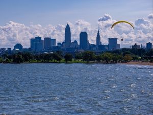 Preview wallpaper parachutist, parachute, sea, water, beach