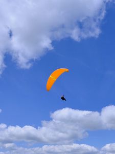 Preview wallpaper parachutist, parachute, sky, clouds