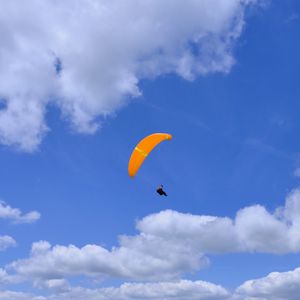 Preview wallpaper parachutist, parachute, sky, clouds