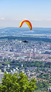 Preview wallpaper paraglider, city, buildings, flight, trees