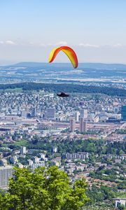 Preview wallpaper paraglider, city, buildings, flight, trees