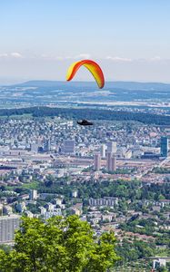 Preview wallpaper paraglider, city, buildings, flight, trees