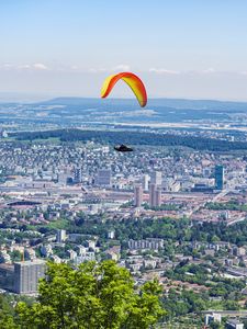 Preview wallpaper paraglider, city, buildings, flight, trees