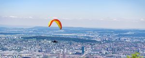 Preview wallpaper paraglider, city, buildings, flight, trees