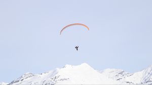Preview wallpaper paraglider, man, flight, mountains, minimalism
