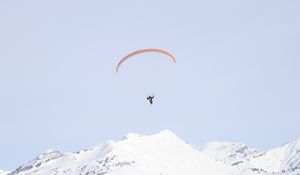 Preview wallpaper paraglider, man, flight, mountains, minimalism