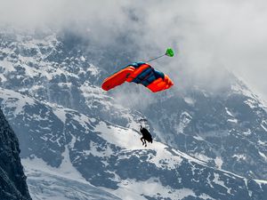 Preview wallpaper paraglider, parachute, mountains, snow, snowy