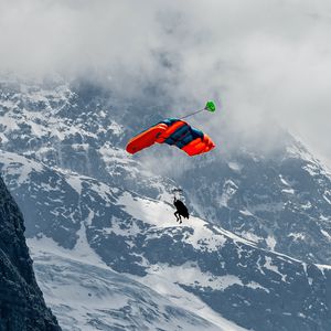Preview wallpaper paraglider, parachute, mountains, snow, snowy