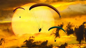 Preview wallpaper paraglider, paragliding, clouds, sky, sun